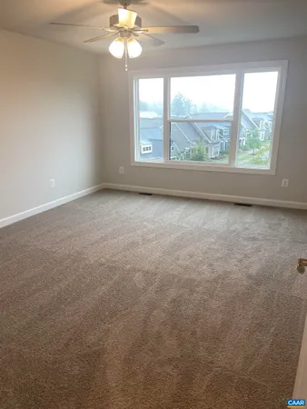 a view of an empty room and a window