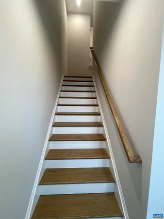 a kitchen with stainless steel appliances granite countertop a sink a stove and a microwave