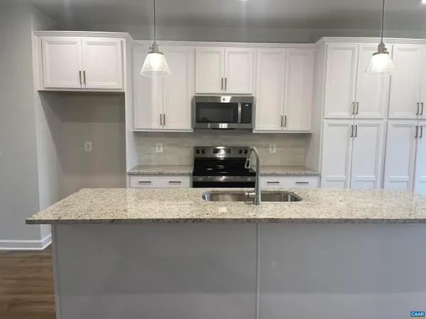a view of fireplace with wooden floor
