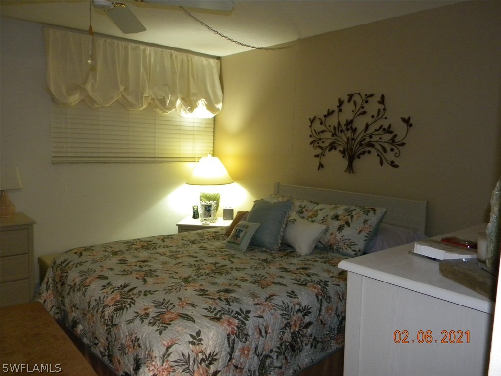 2121 Collier Avenue, Unit 102 Fort Myers, FL 33901 - Photo 13 of 28 a bed room with a bed