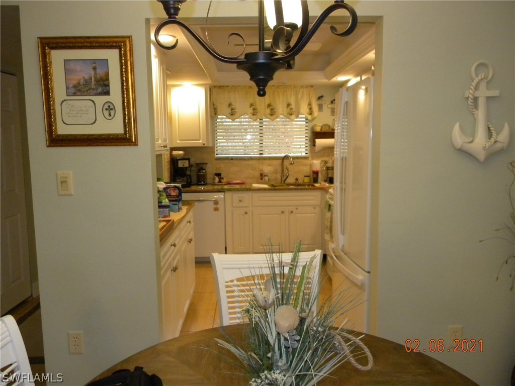 2121 Collier Avenue, Unit 102 Fort Myers, FL 33901 - Photo 17 of 28 a bathroom with a sink a mirror and a shower
