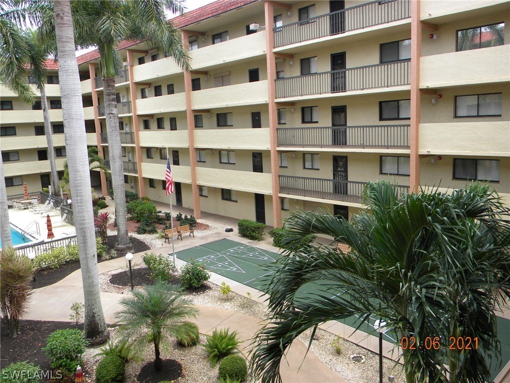 2121 Collier Avenue, Unit 102 Fort Myers, FL 33901 - Photo 20 of 28 a view of building with yard and staircase