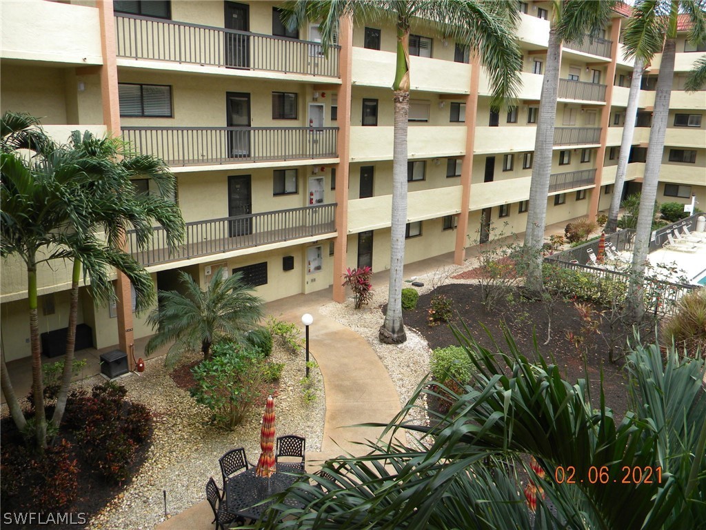 2121 Collier Avenue, Unit 102 Fort Myers, FL 33901 - Photo 21 of 28 a aerial view of a residential apartment building with a yard