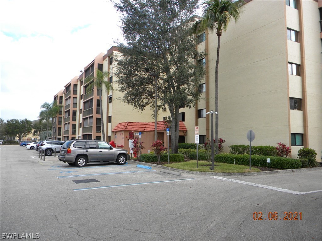 2121 Collier Avenue, Unit 102 Fort Myers, FL 33901 - Photo 26 of 28 a car parked in front of a building