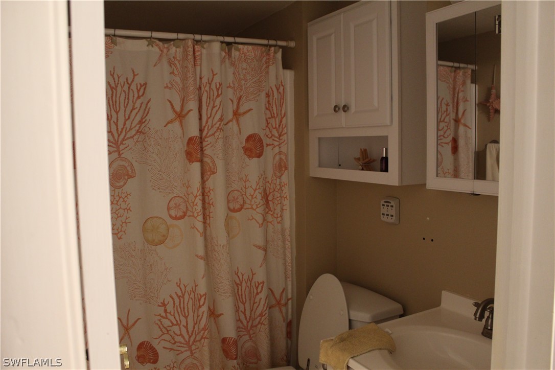 2121 Collier Avenue, Unit 102 Fort Myers, FL 33901 - Photo 28 of 28 a bathroom with a shower and a toilet
