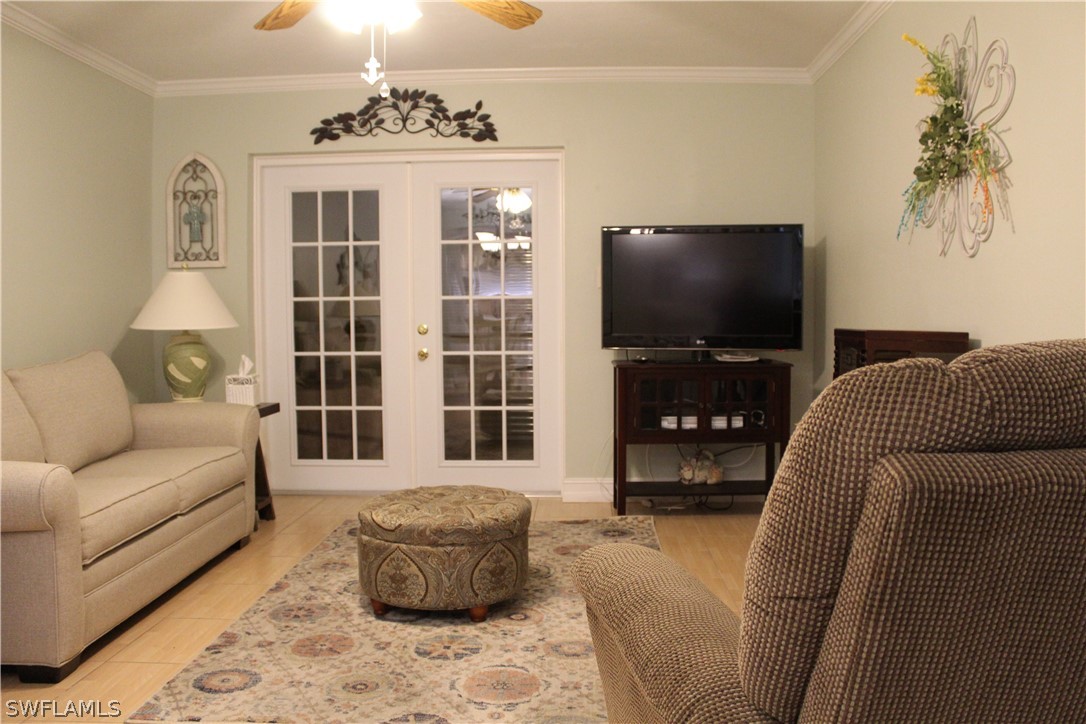 2121 Collier Avenue, Unit 102 Fort Myers, FL 33901 - Photo 5 of 28 a living room with furniture and a flat screen tv