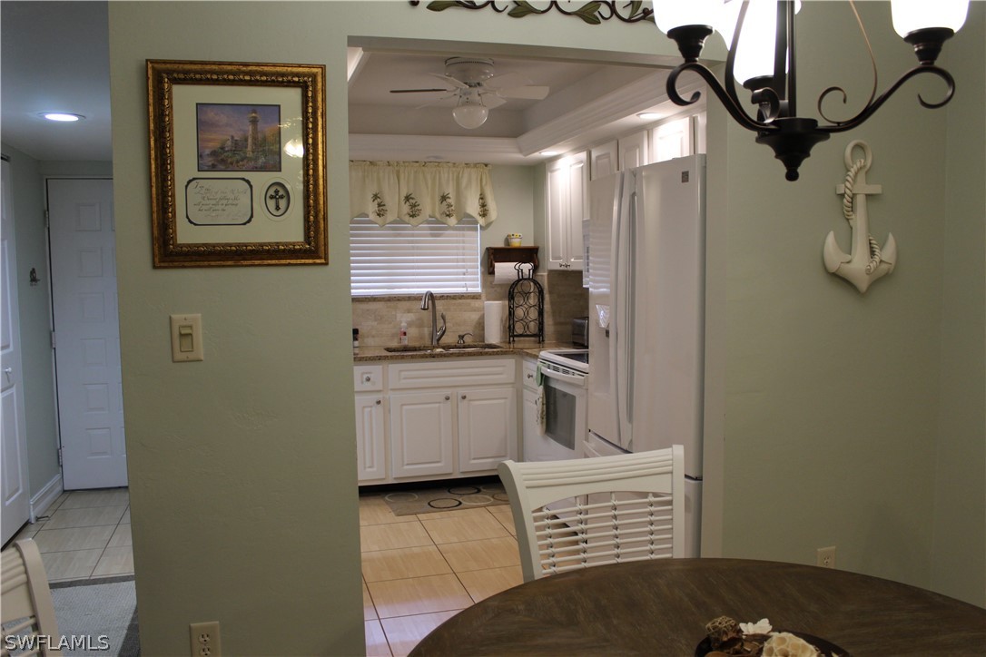 2121 Collier Avenue, Unit 102 Fort Myers, FL 33901 - Photo 6 of 28 a bathroom with a sink a mirror and a shower