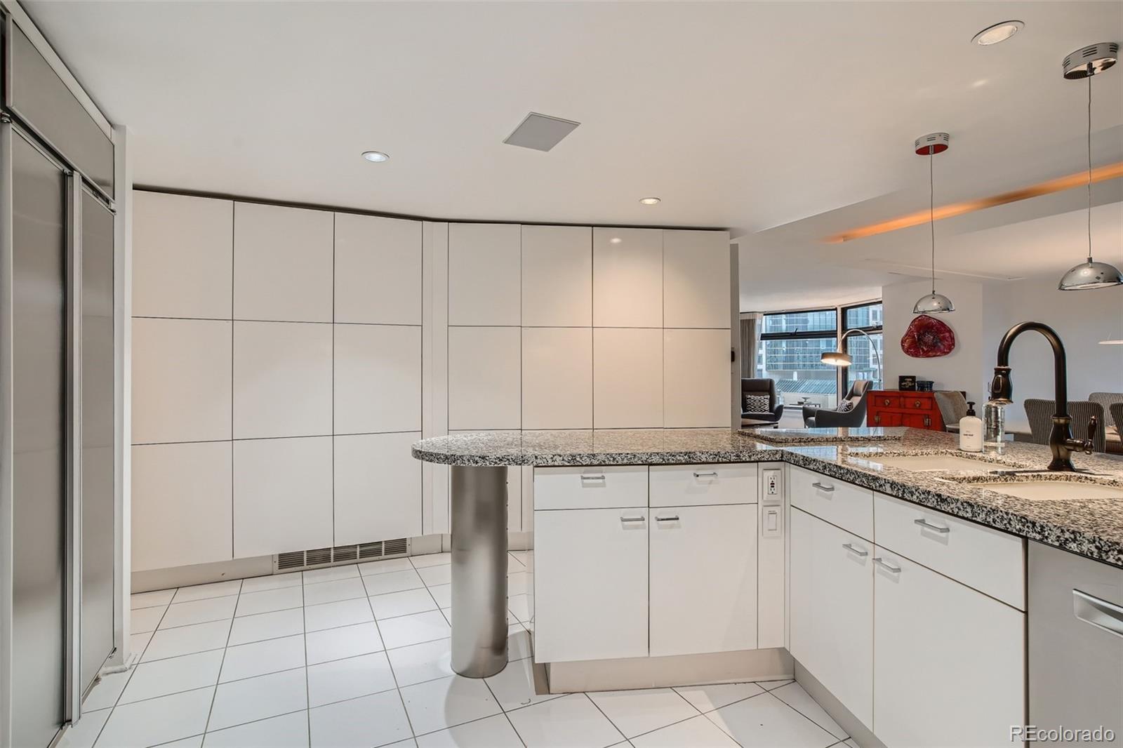 1777 Larimer Street, Unit 710 Denver, CO 80202 - Photo 4 of 28 a kitchen with a sink and cabinets