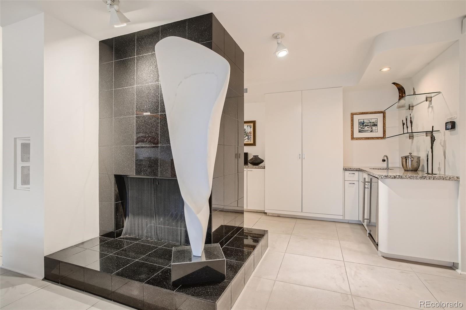 1777 Larimer Street, Unit 710 Denver, CO 80202 - Photo 9 of 28 a view of a kitchen cabinets and a stove