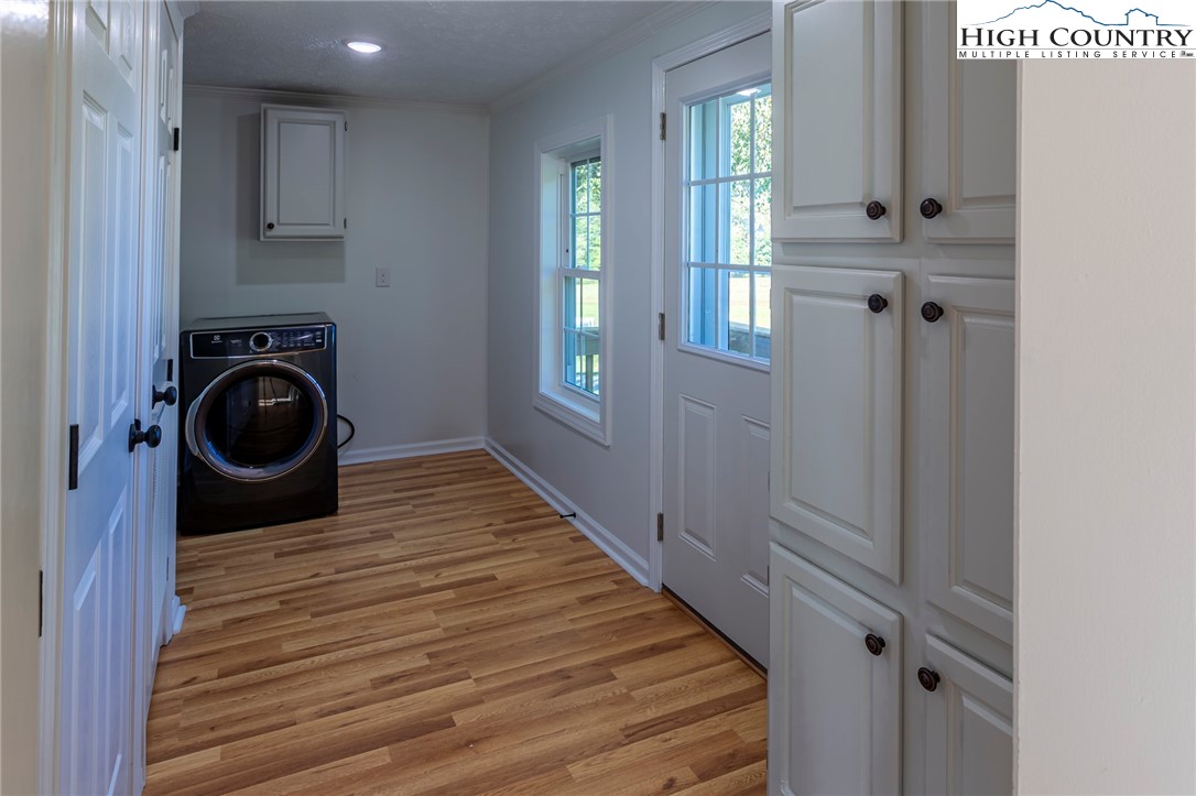 101 Beau Rivage Drive Crumpler, NC 28617 - Photo 11 of 47 a view of a hallway with washer and dryer