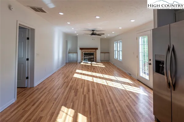 a view of a kitchen from the hallway