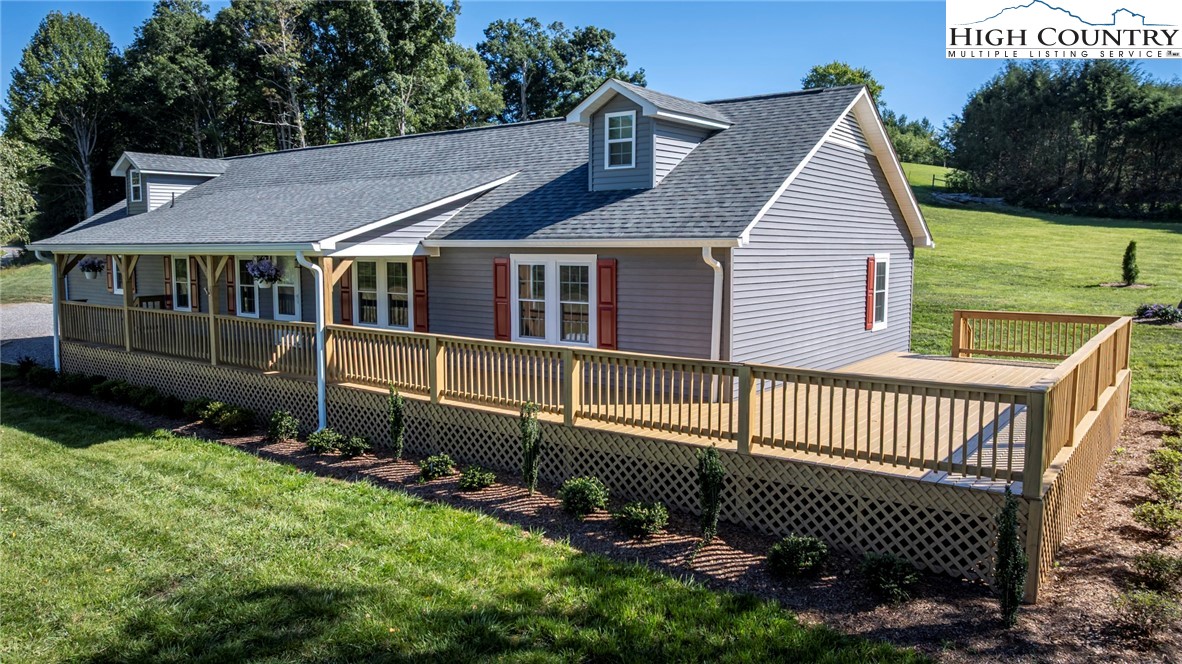 101 Beau Rivage Drive Crumpler, NC 28617 - Photo 2 of 47 a view of a house with a yard
