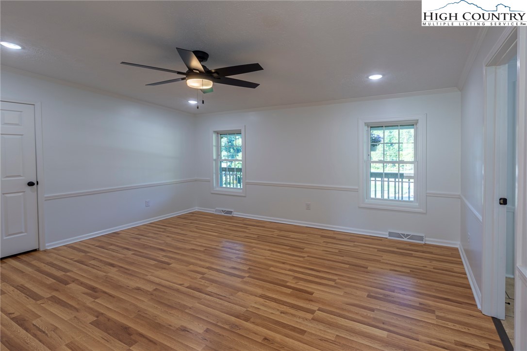101 Beau Rivage Drive Crumpler, NC 28617 - Photo 21 of 47 a view of empty room with wooden floor and fan