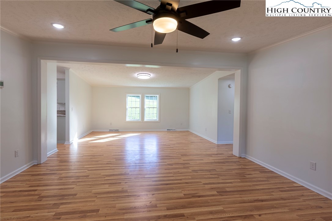 101 Beau Rivage Drive Crumpler, NC 28617 - Photo 27 of 47 a view of empty room with wooden floor and fan