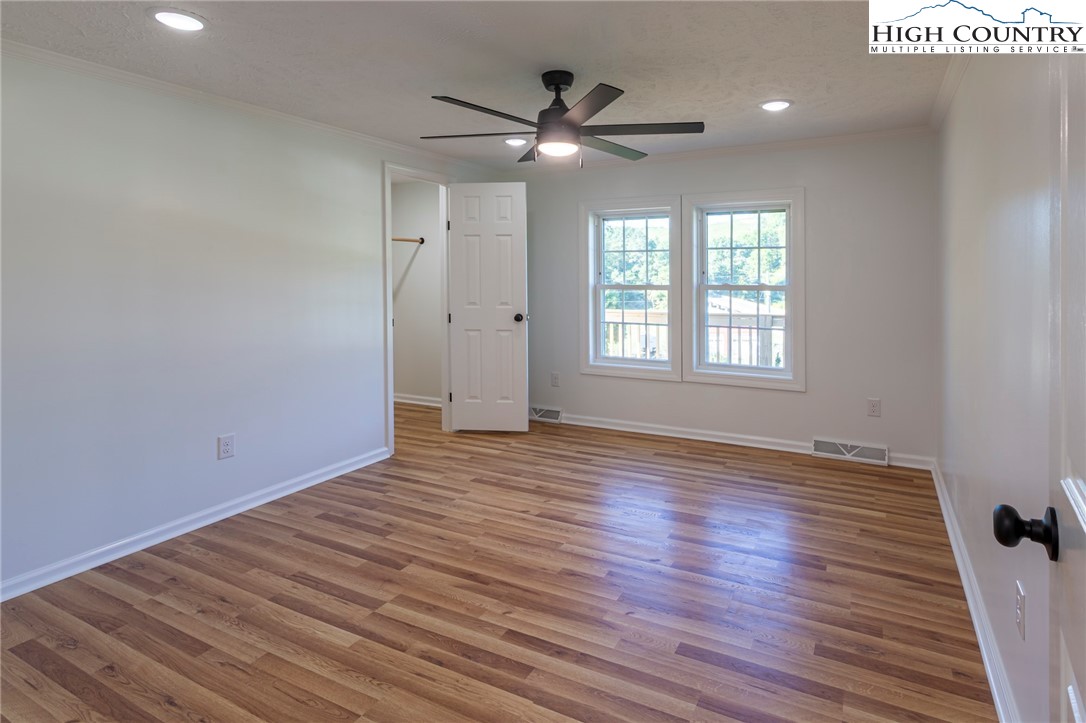 101 Beau Rivage Drive Crumpler, NC 28617 - Photo 29 of 47 a view of an empty room with wooden floor and a window