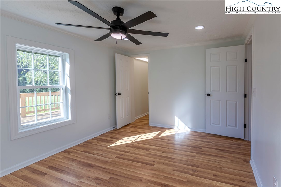 101 Beau Rivage Drive Crumpler, NC 28617 - Photo 33 of 47 a view of empty room with wooden floor and fan