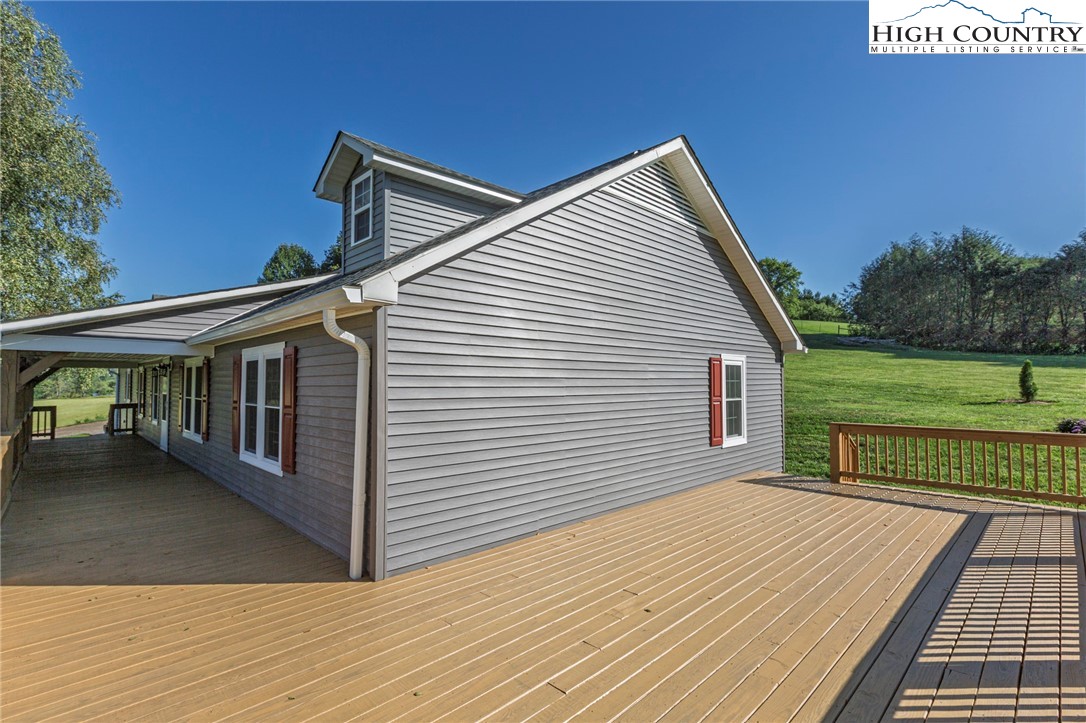 101 Beau Rivage Drive Crumpler, NC 28617 - Photo 35 of 47 a view of a house with wooden deck