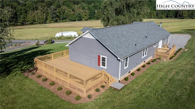 a aerial view of a house with a yard