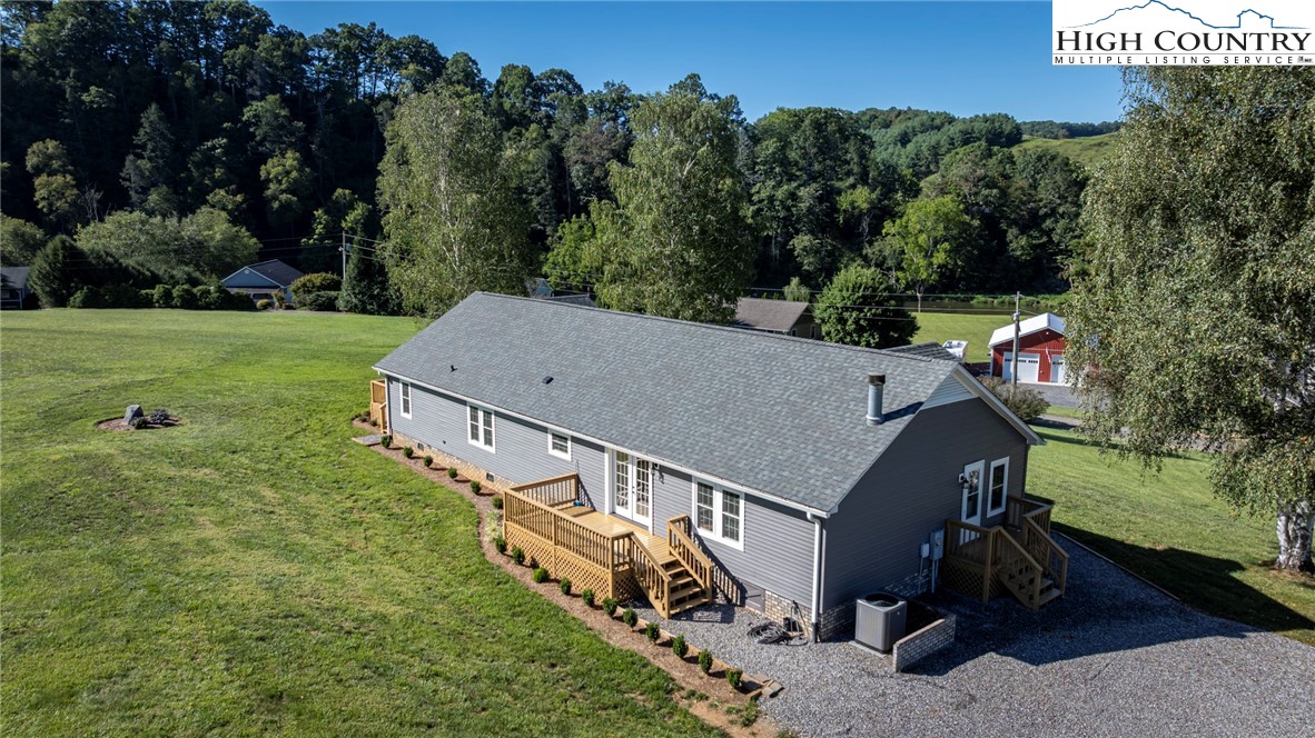 101 Beau Rivage Drive Crumpler, NC 28617 - Photo 46 of 47 a view of a house with a yard and trees