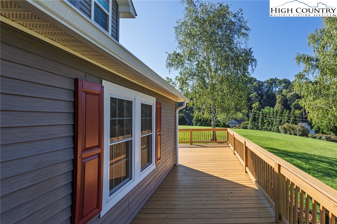 101 Beau Rivage Drive Crumpler, NC 28617 - Photo 7 of 47 a view of a balcony with wooden floor and fence