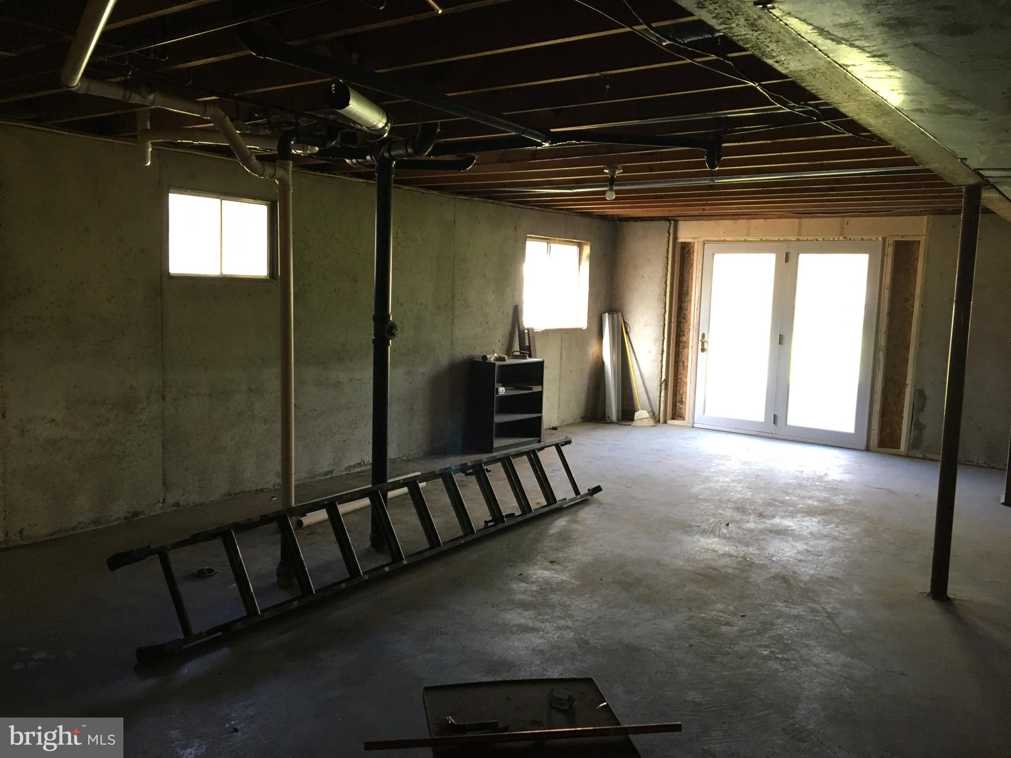 1965 Smoky Road Huntingtown, MD 20639 - Photo 22 of 32 Basement ground floor exit