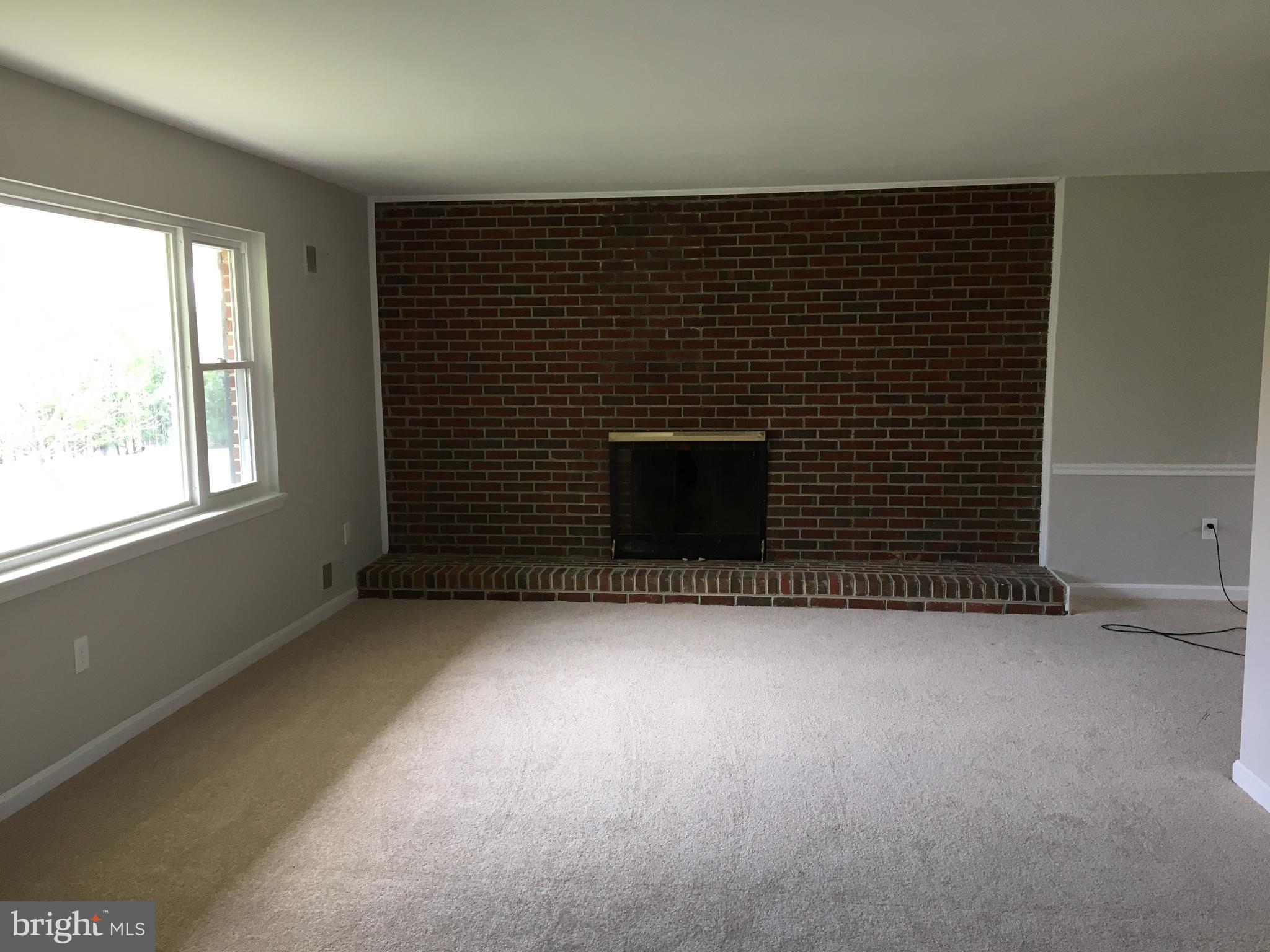 1965 Smoky Road Huntingtown, MD 20639 - Photo 10 of 32 Living Room with Fireplace