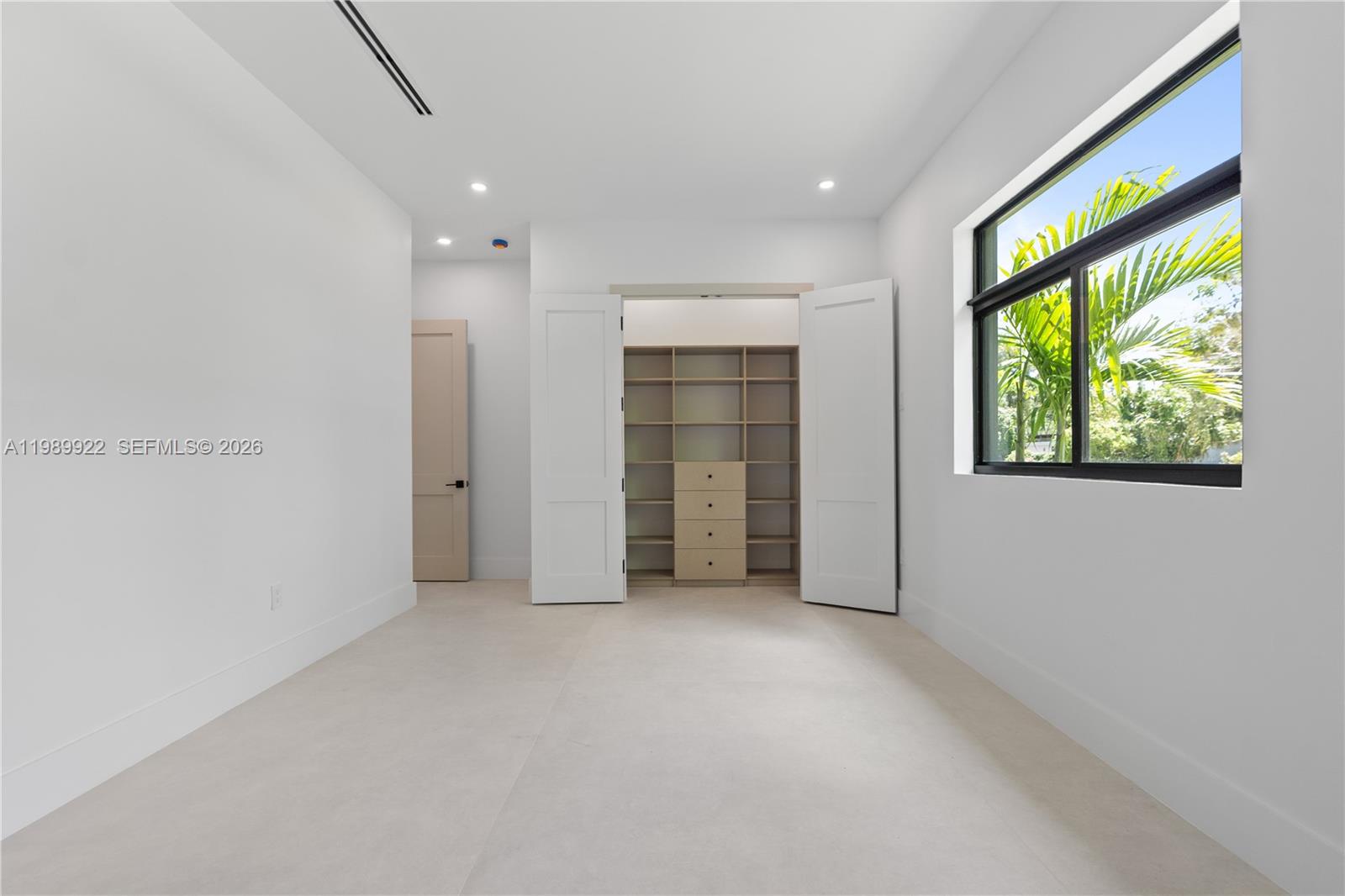 6221 Southwest 60th Street South Miami, FL 33143 - Photo 26 of 42 an empty room with windows and closet