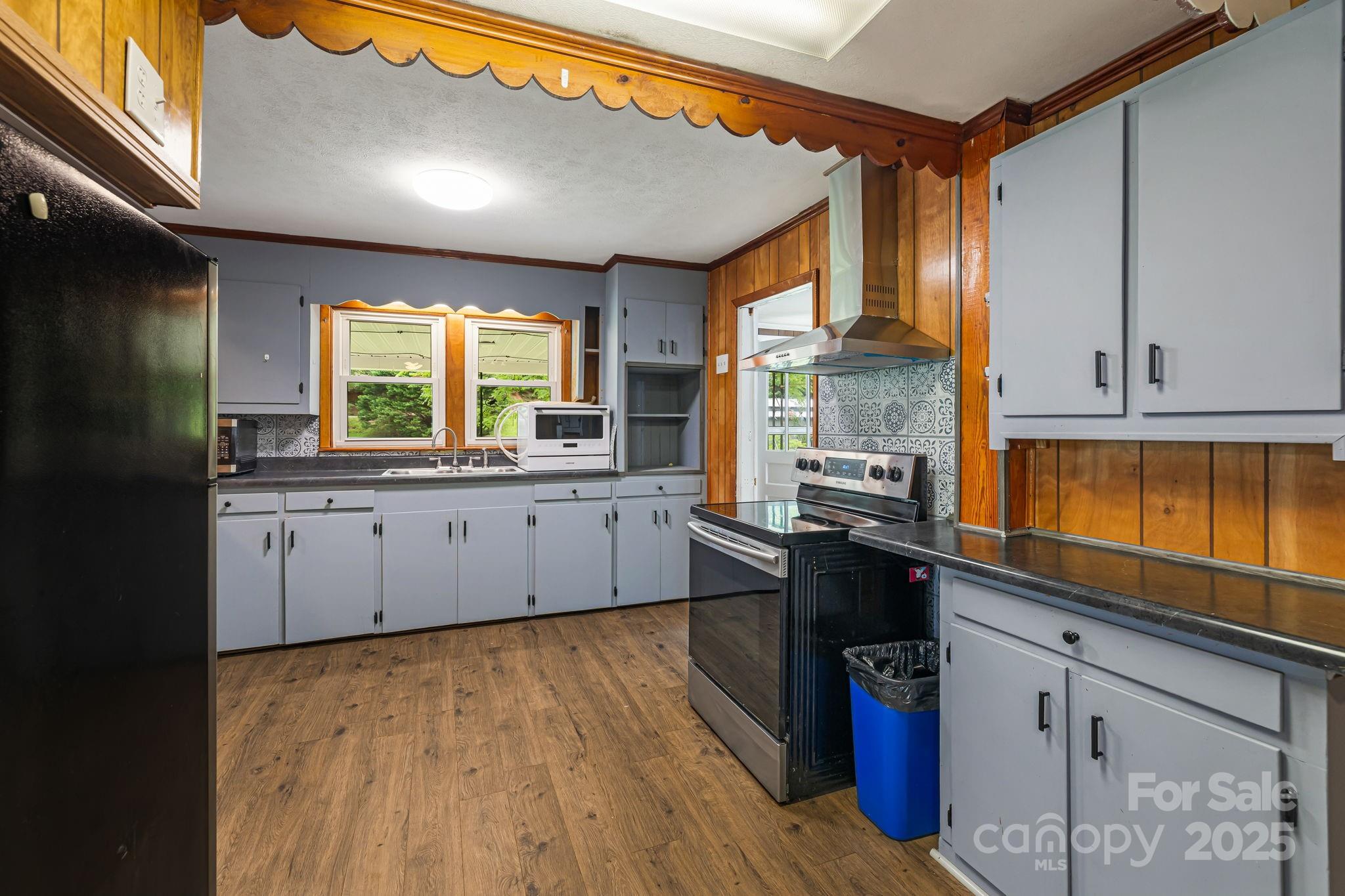 8171 Sugar Hill Road Marion, NC 28752 - Photo 11 of 27 a kitchen with stainless steel appliances granite countertop a sink and cabinets