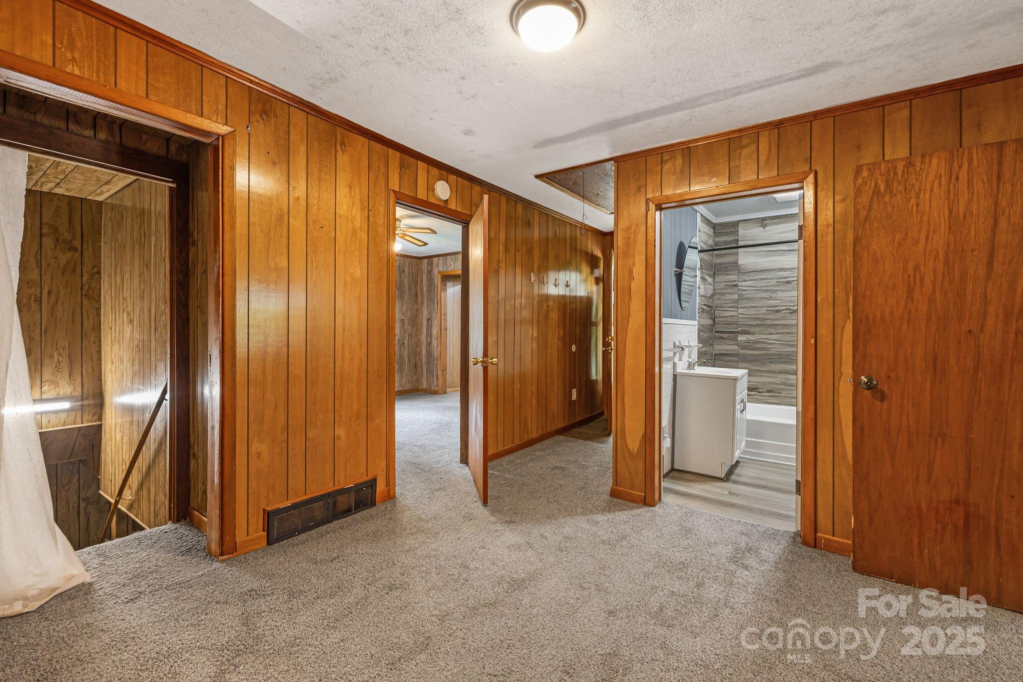 8171 Sugar Hill Road Marion, NC 28752 - Photo 14 of 27 an empty room with closet and mirrors