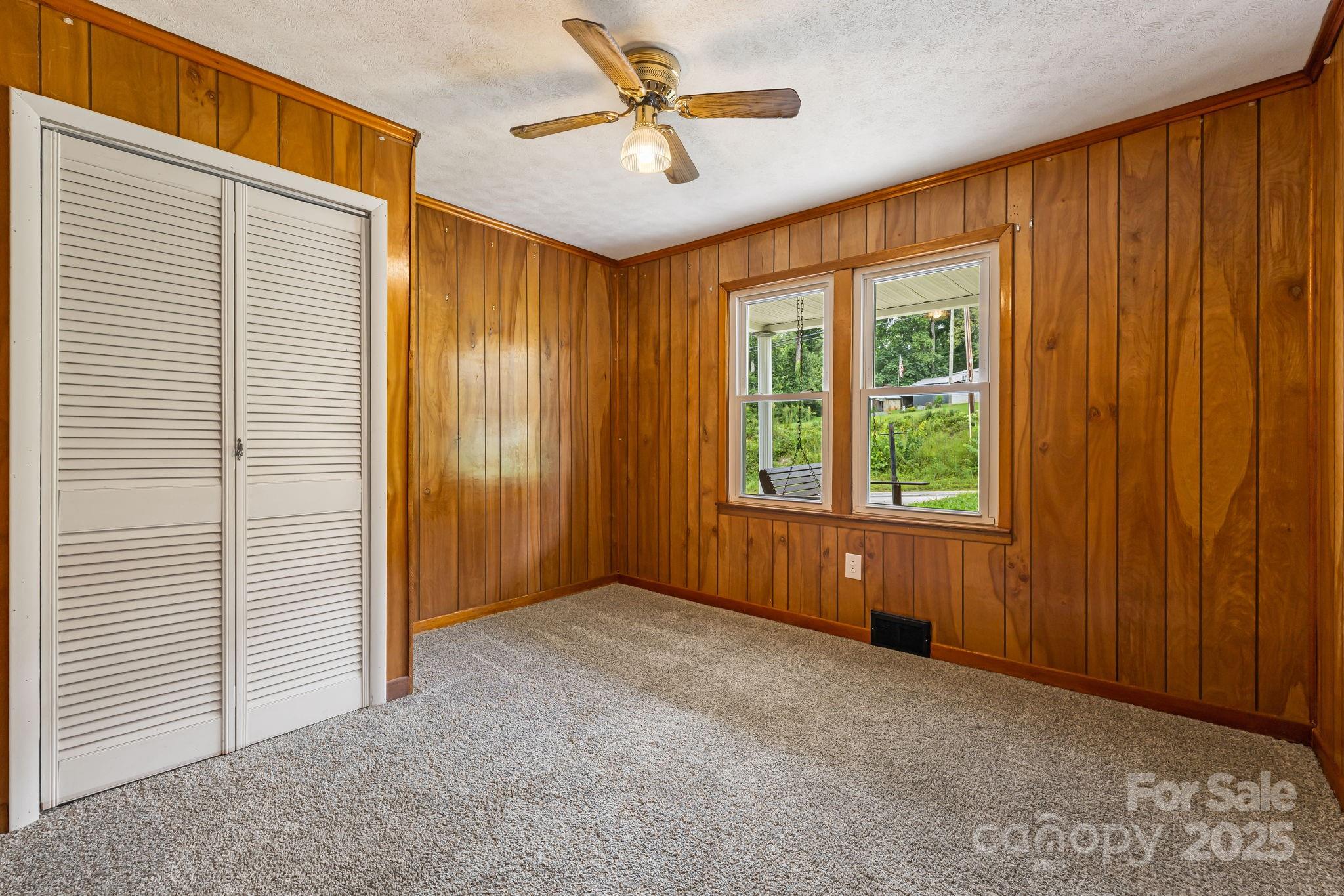 8171 Sugar Hill Road Marion, NC 28752 - Photo 16 of 27 a view of a livingroom with a ceiling fan and window