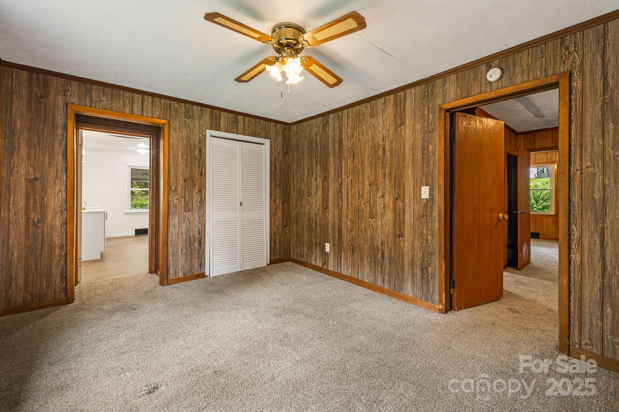 8171 Sugar Hill Road Marion, NC 28752 - Photo 18 of 27 an empty room with fan and entrance
