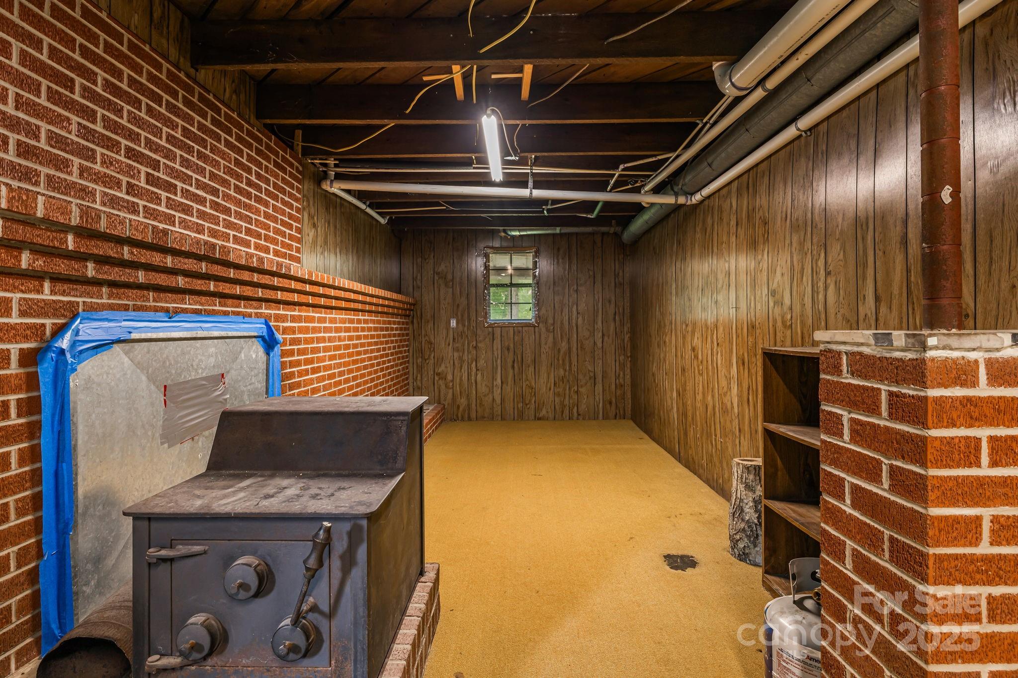 8171 Sugar Hill Road Marion, NC 28752 - Photo 23 of 27 a view of an empty room with wooden floor
