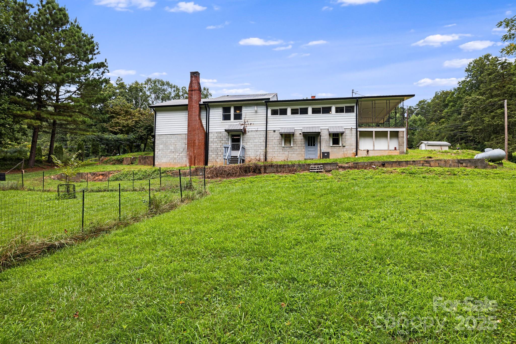 8171 Sugar Hill Road Marion, NC 28752 - Photo 27 of 27 a view of a house with a backyard