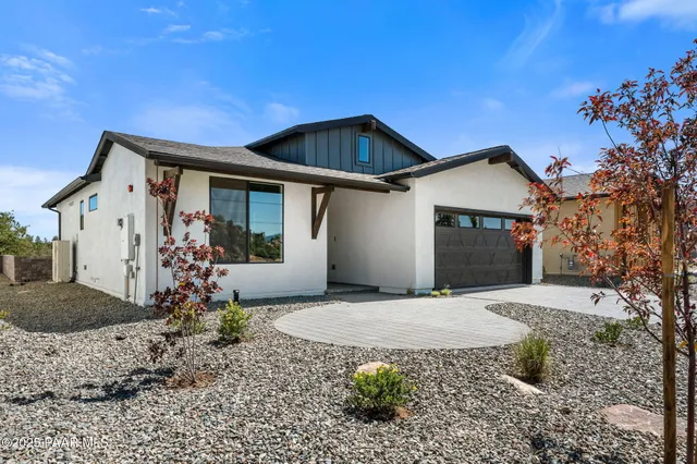 a front view of a house with yard