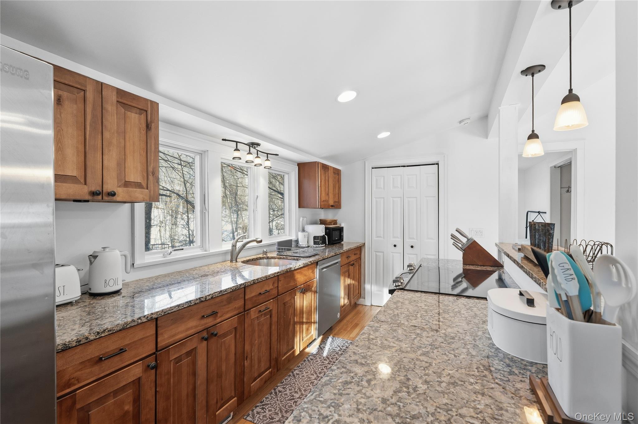 37 Sawmill Road Putnam Valley, NY 10579 - Photo 23 of 23 a large kitchen with stainless steel appliances a large counter top a stove a sink a refrigerator and a cabinets