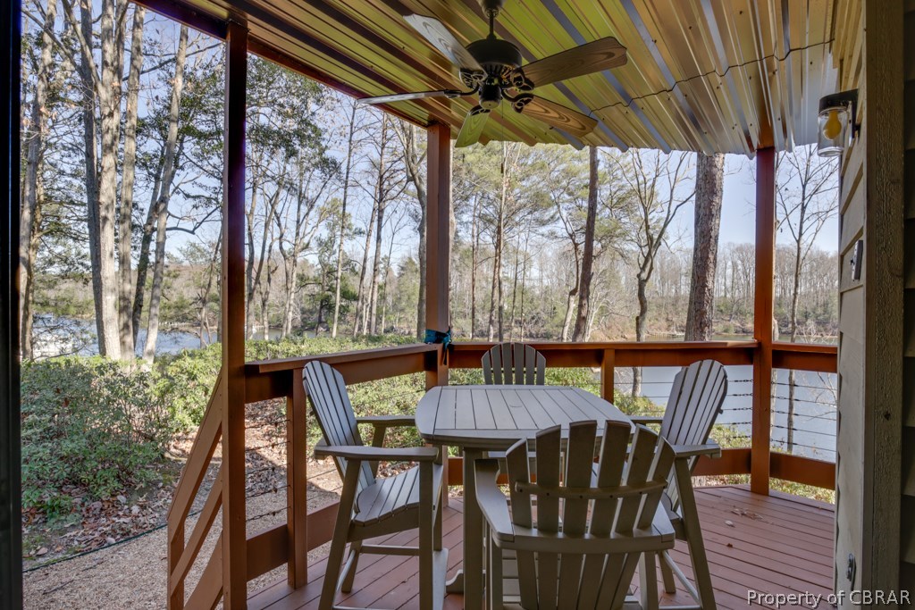 63 Mariners Point Lane, Unit A Hartfield, VA 23071 - Photo 8 of 29 Wrap around covered waterside deck cooled by ceiling fans for those summer nights.