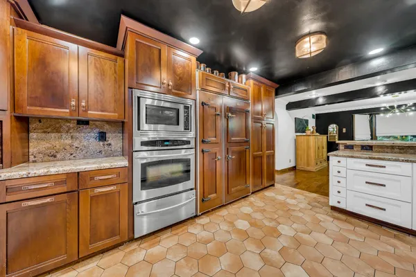 a kitchen with a stove and a sink