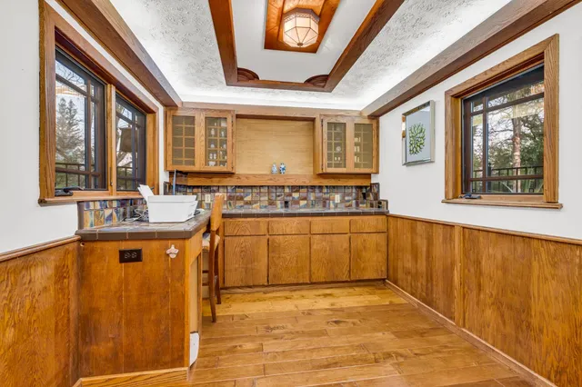 a view of a hallway view with wooden floor and staircase