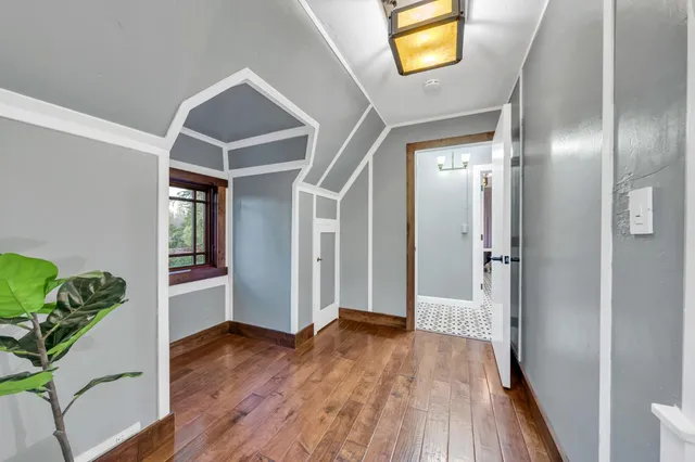a bathroom with a sink mirror and toilet