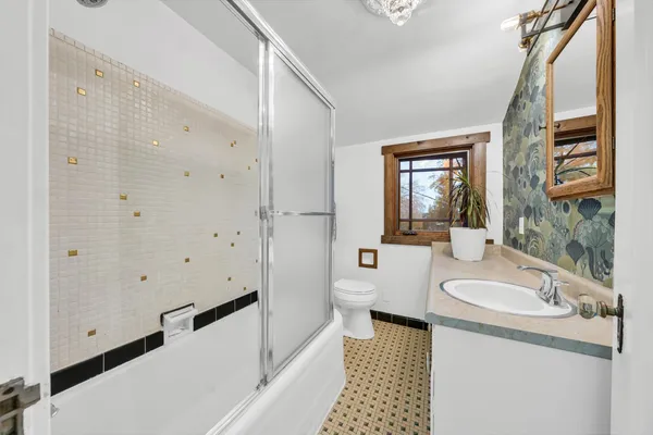 a front view of house with deck and outdoor seating