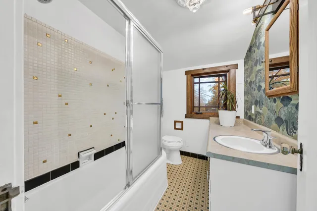 a front view of house with deck and outdoor seating