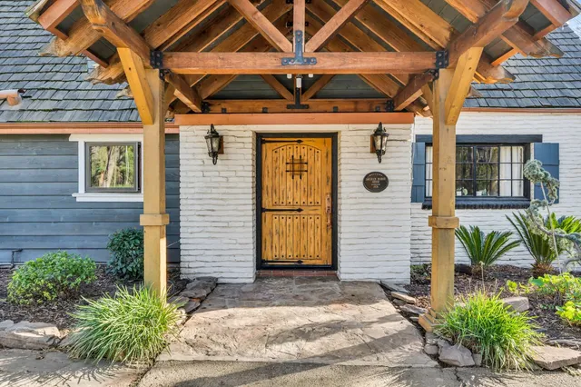 a front view of a house with garden