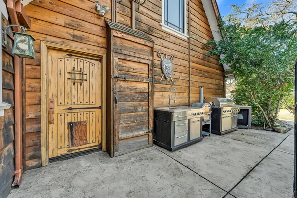 a kitchen with a refrigerator a stove top oven a sink and dishwasher with wooden floor