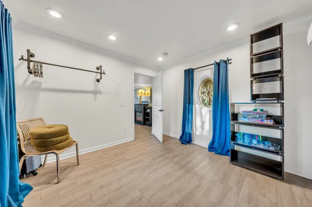 a view of a house with a flower garden