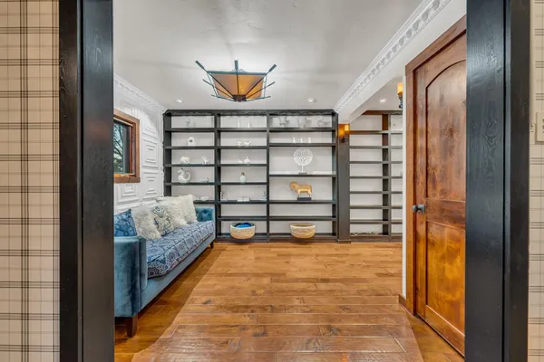 a view of a bedroom with wooden floor and bedroom