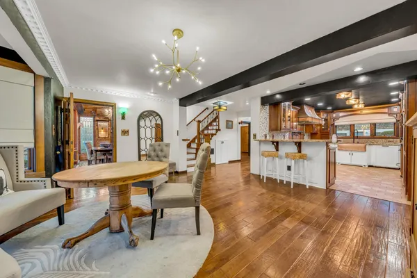 a view of a livingroom with furniture window and wooden floor