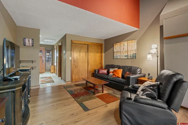 a bedroom with a bed and a table in it