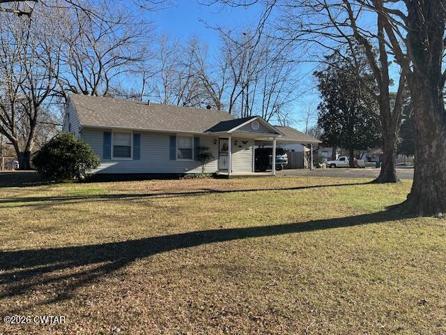 4036 Hawthorne Street Milan, TN 38358 - Photo 11 of 13 a front view of a house with a yard