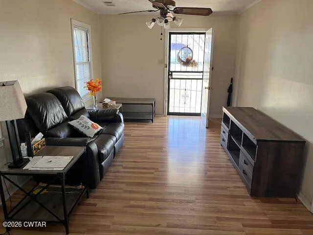 a living room with furniture and a window
