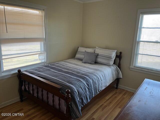 4036 Hawthorne Street Milan, TN 38358 - Photo 6 of 13 a bedroom with a bed with wooden floor